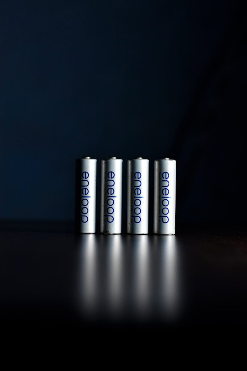 a group of three batteries sitting on top of a table